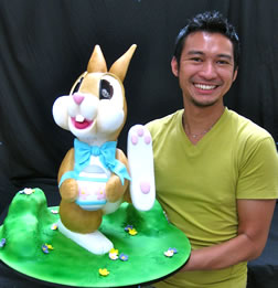 Handis Cakes : Man holding up a decorated bugs bunny cake