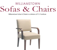 cream chair with brown arm rests