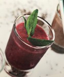 Berries Chia Pudding in a glass with a sice of mint