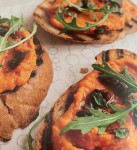 Bruschette With Roast Pepper, Cannellini Pure, Black Olive Relish & Rocket.j